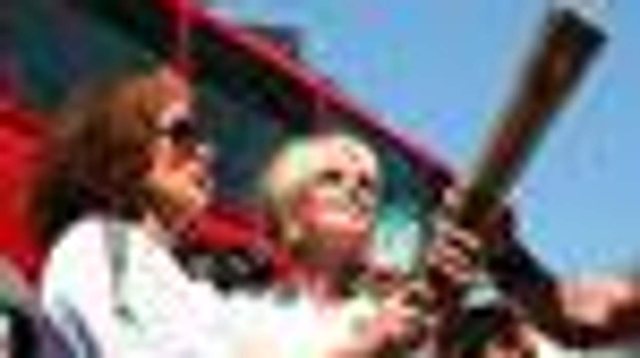 Shot of the Day: Eddie and Patsy Carry Olympic Torch Through London