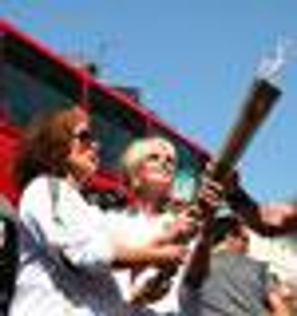 Shot of the Day: Eddie and Patsy Carry Olympic Torch Through London  