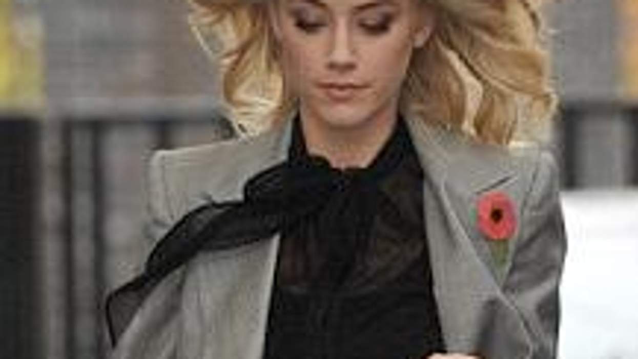 SheWired Shot of the Day: Amber Heard Suits Up With Ruby Red Heels
