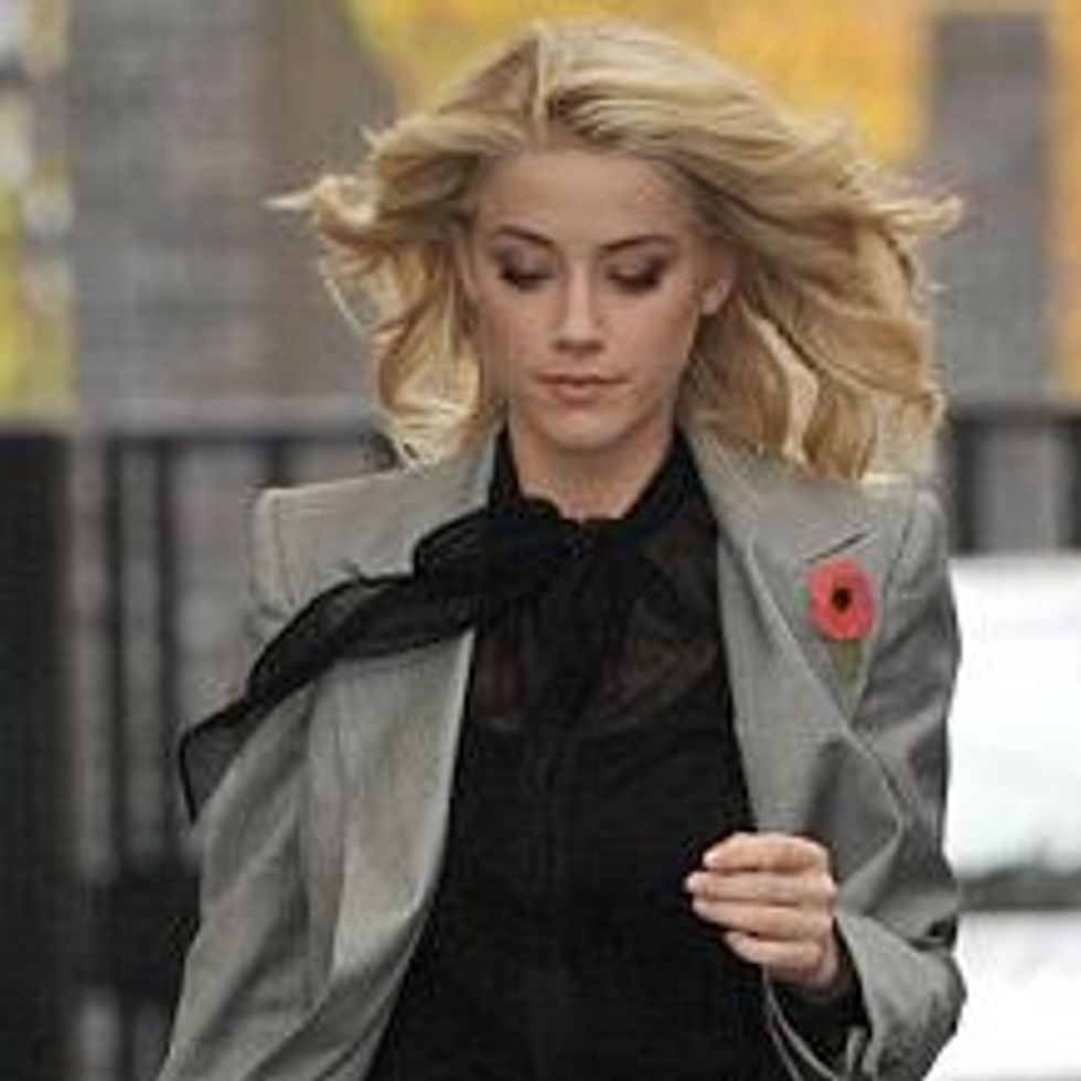 SheWired Shot of the Day: Amber Heard Suits Up With Ruby Red Heels
