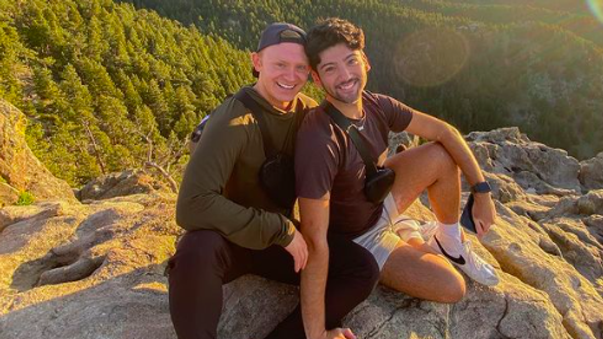 Jose Capetillo and Brendan Ryan sitting on a mountain together.