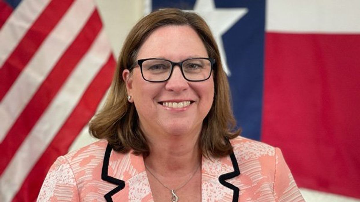 Julia Johnson in front of United States and Texas flags