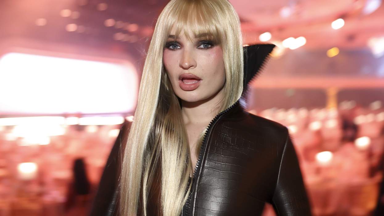 Kim Petras in a leather jumpsuit, representing Kim Petras defending Hunter Schafer
