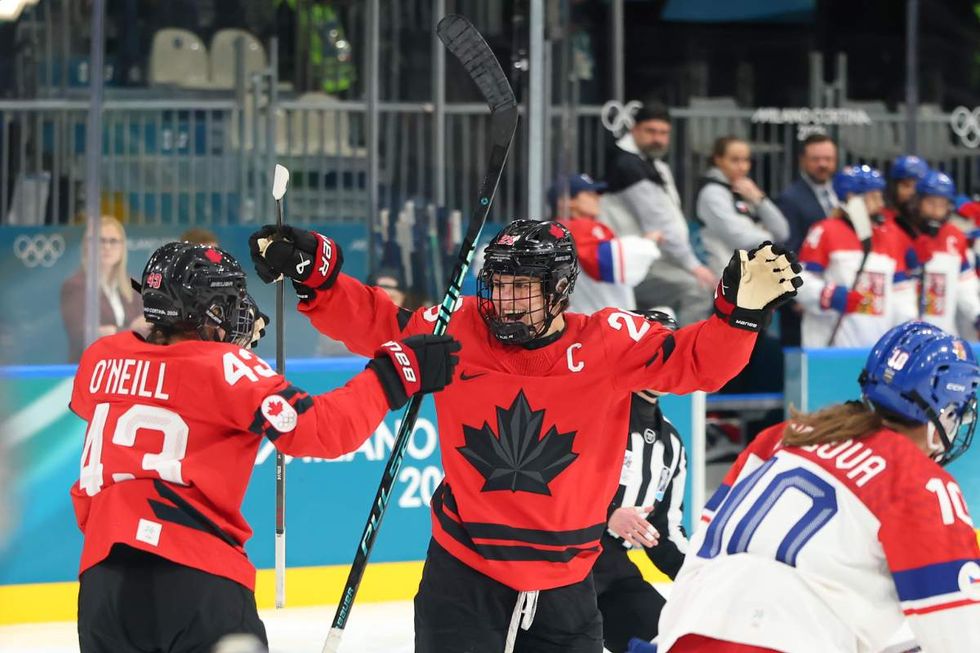 Kristin O'Neill #43 of Team Canada celebrates with teammate Marie-Philip Poulin #29 after a goal in the first period during the Women's Preliminary Round Group A match between Czechia and Canada on day three of the Milano Cortina 2026 Winter Olympic games