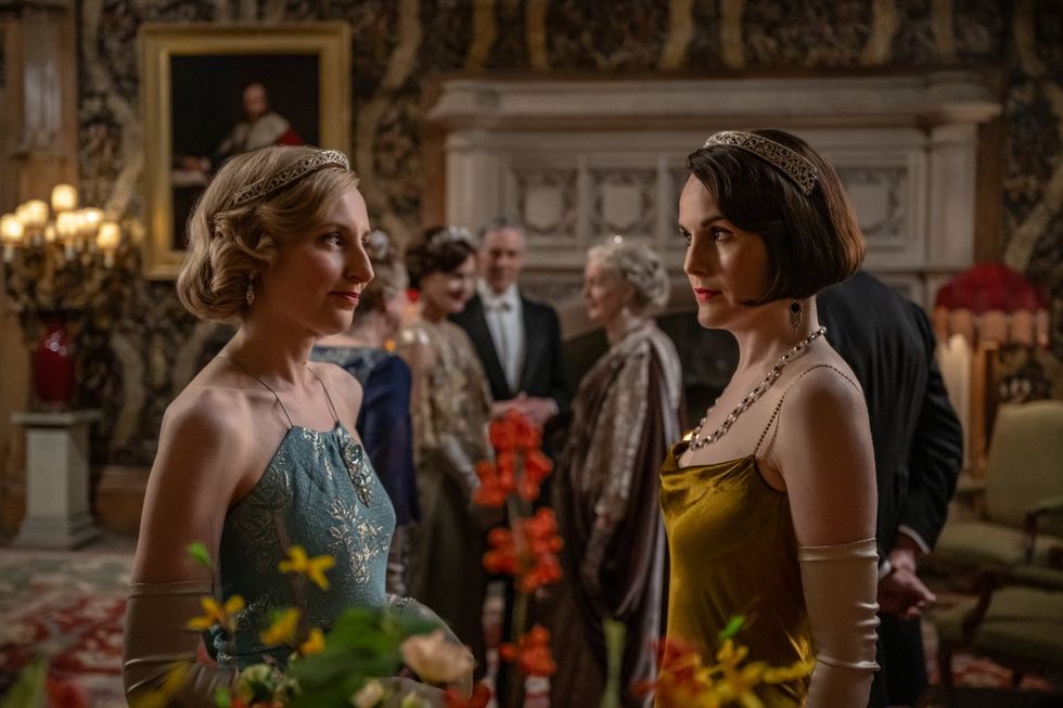 Laura Carmichael stars as Lady Edith and Michelle Dockery as Lady Mary in DOWNTON ABBEY: The Grand Finale