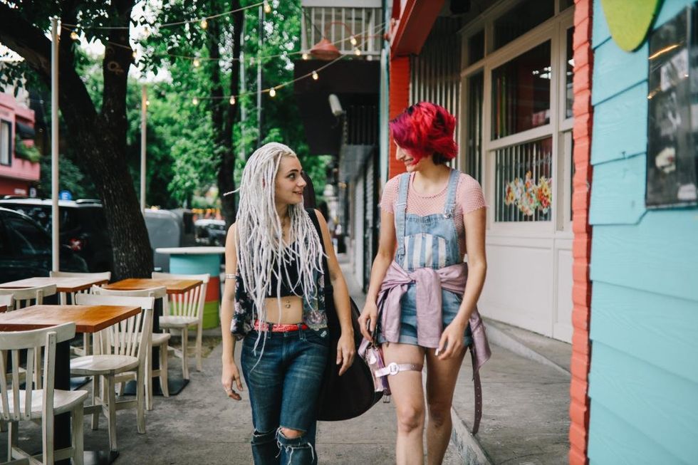 lesbian couples chat and walk down the street