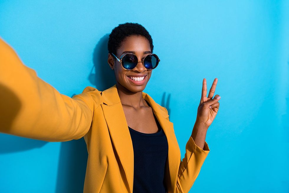 lesbian flashes piece sign