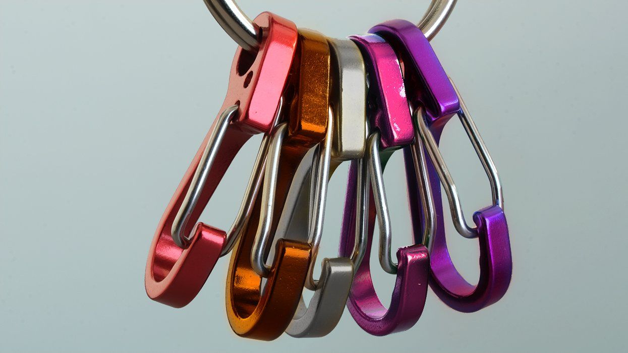 lesbian pride flag colored carabiners on a ring