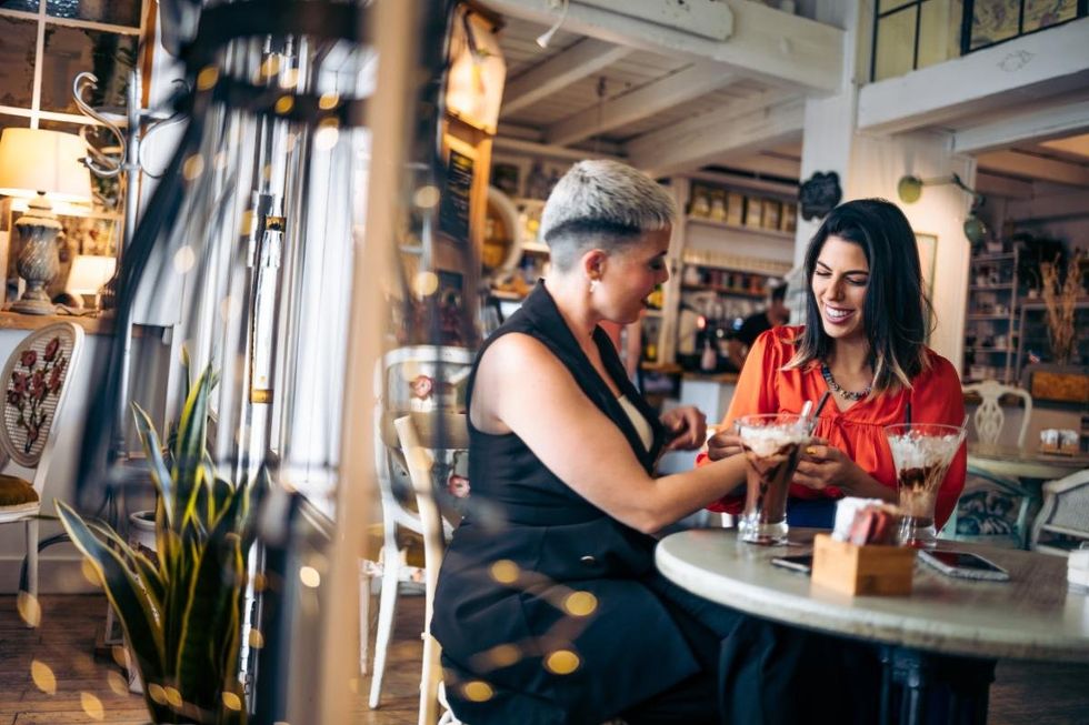 Lesbians flirt in a bar