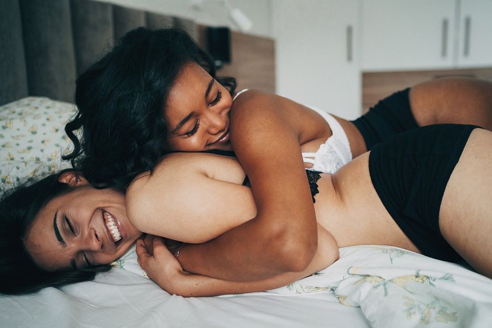 Libra season based on your zodiac sign: lesbian couple in bed