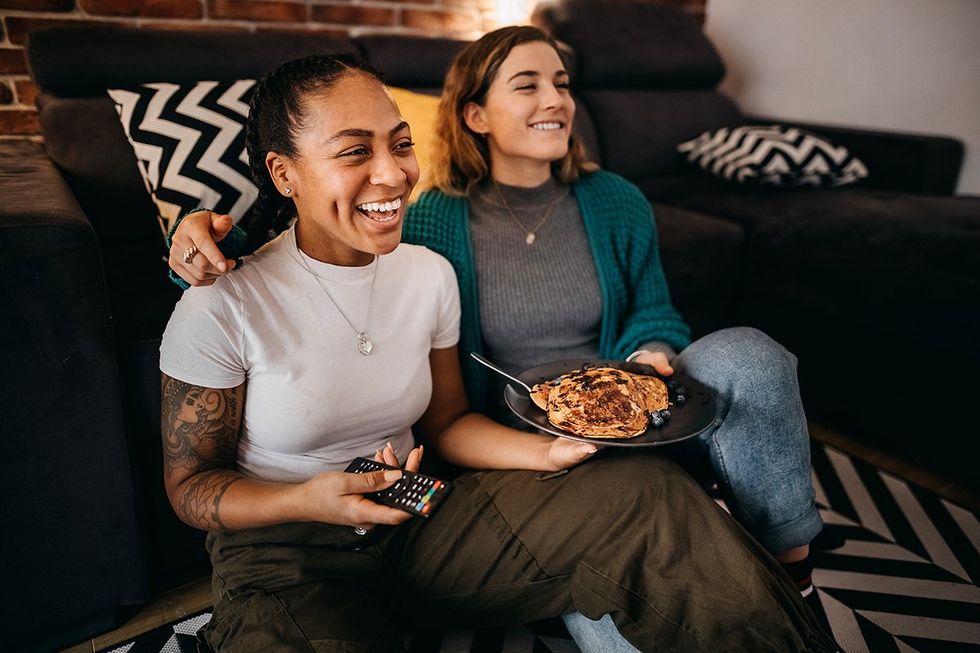 Libra season based on your zodiac sign: lesbian couple watches tv