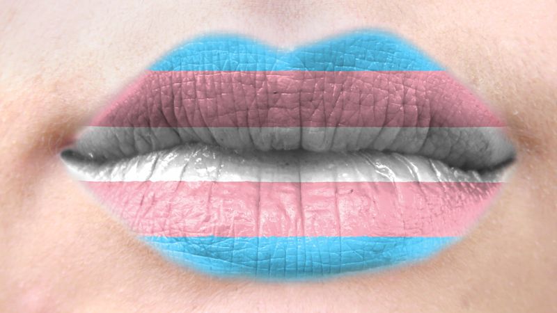Lips painted the colors of the transgender flag