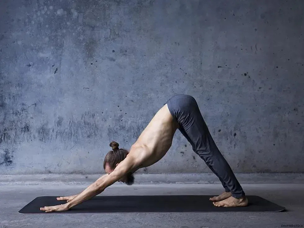 man doing a downward dog