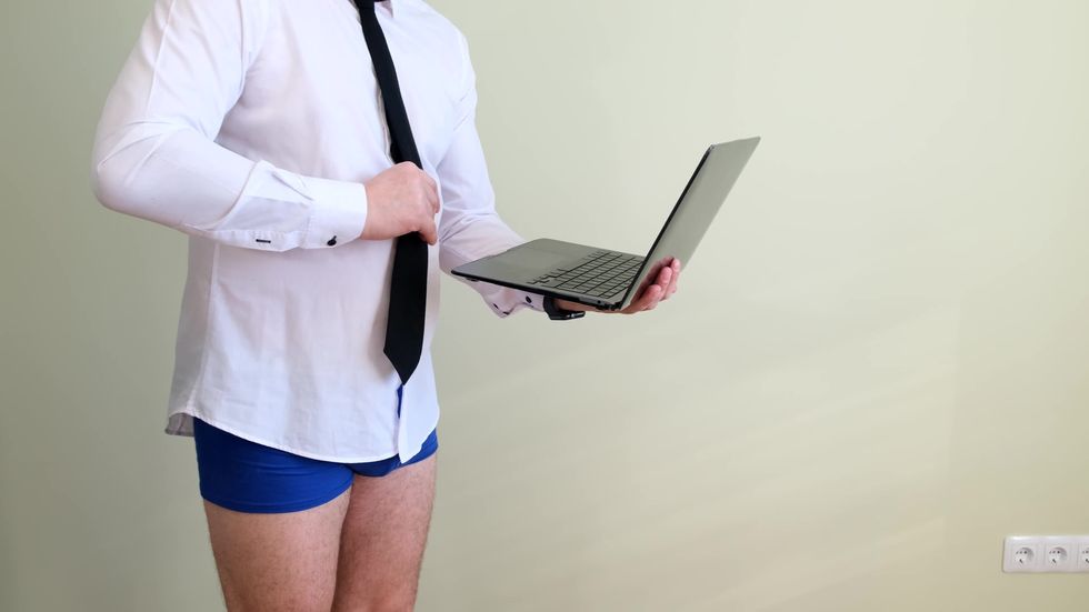 man in underwear on computer