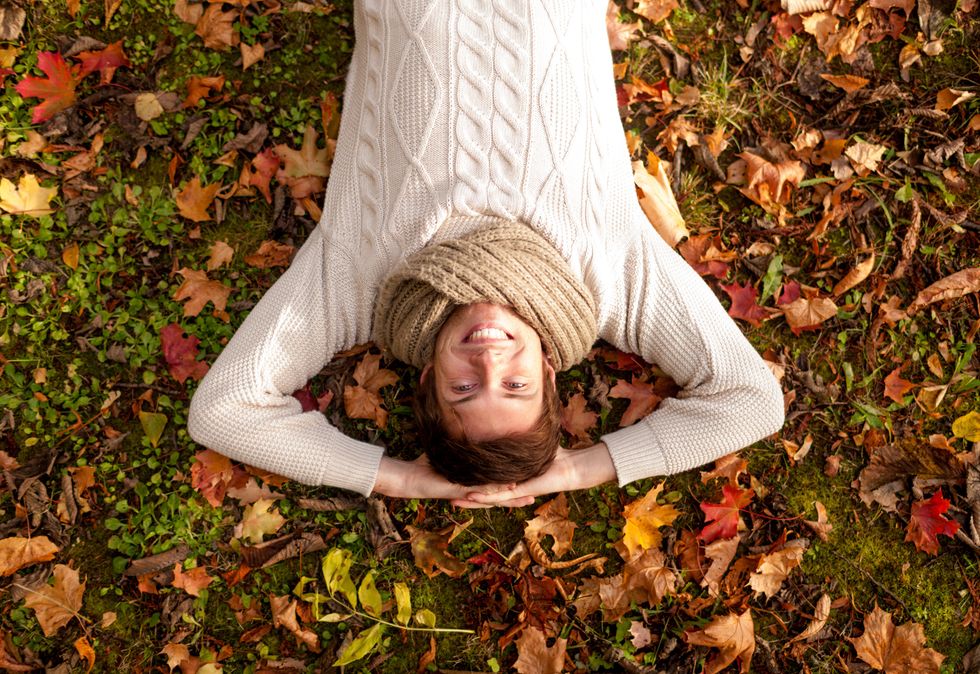 man laying down in the leaves
