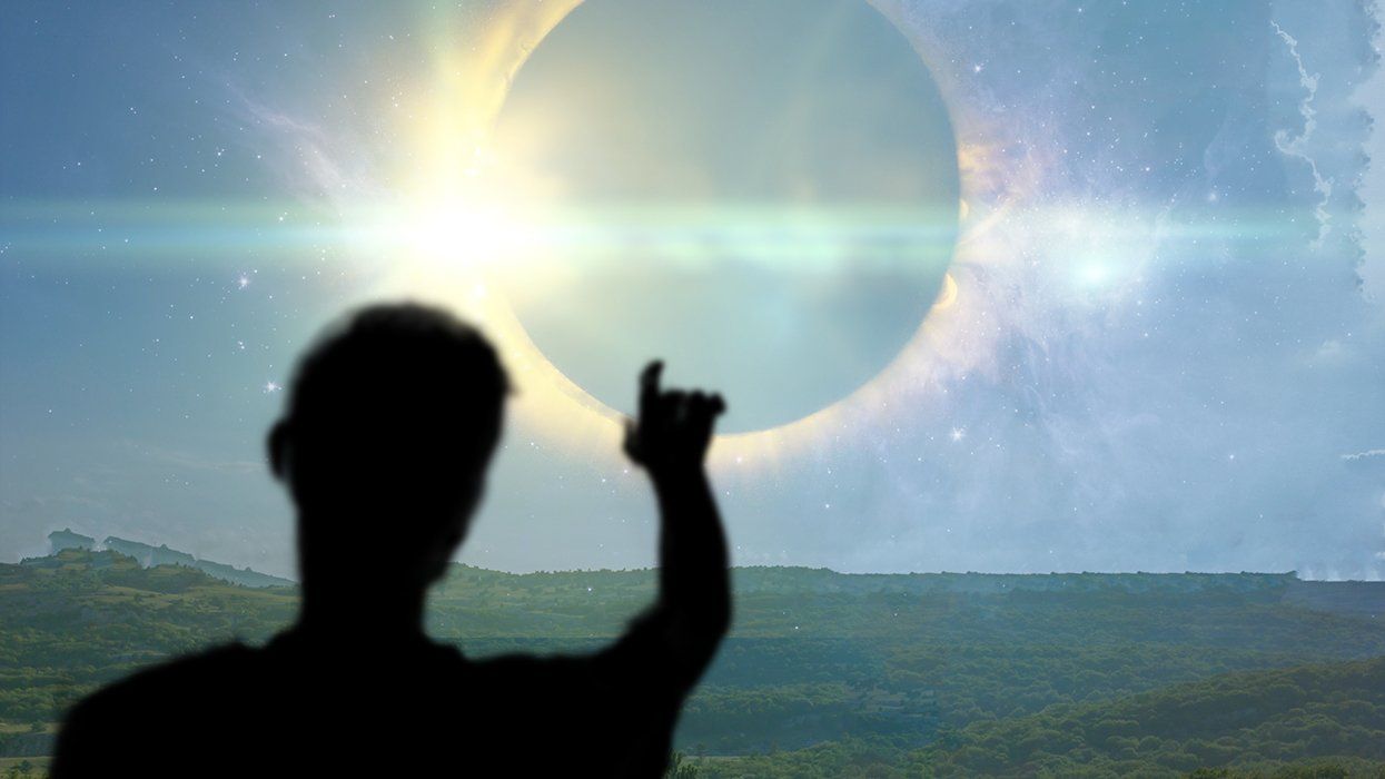 Man looking at a solar eclipse