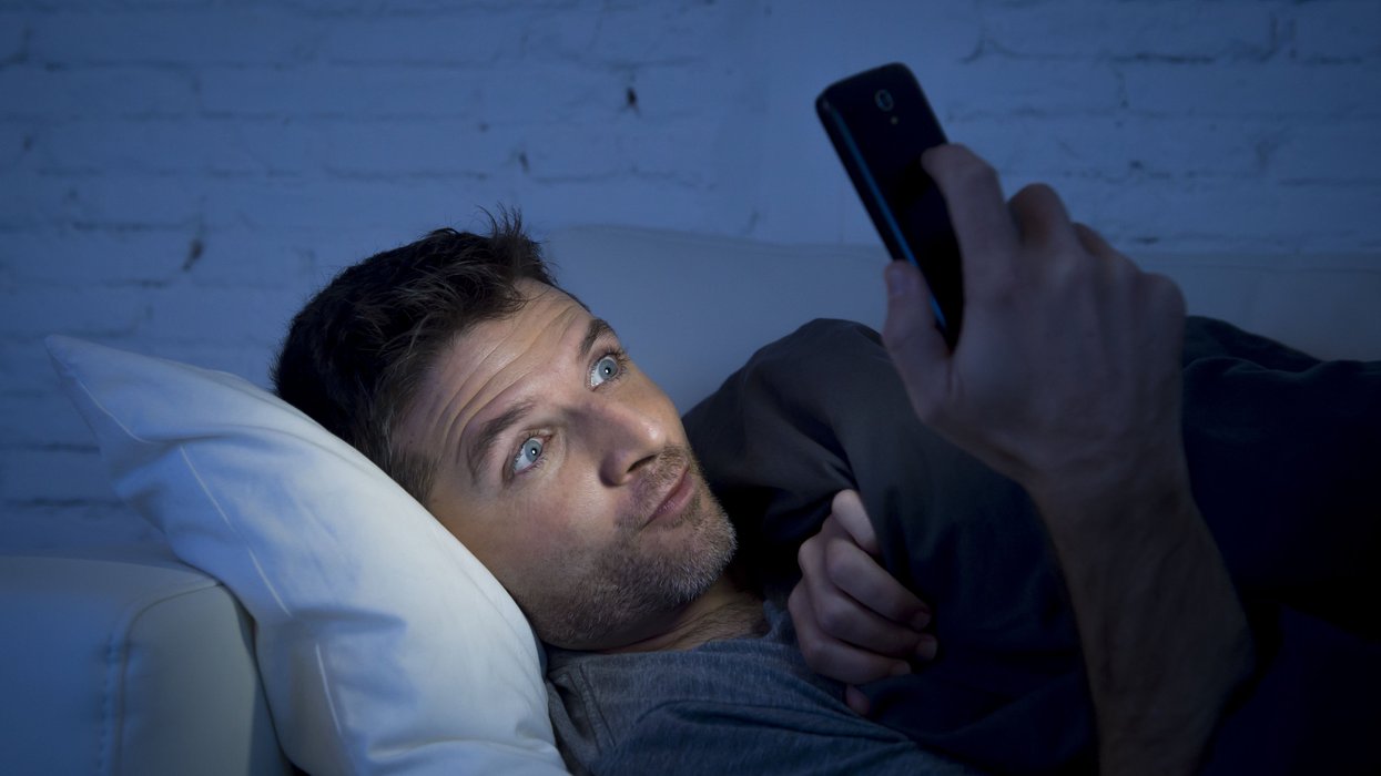 Man looking at his cell phone.