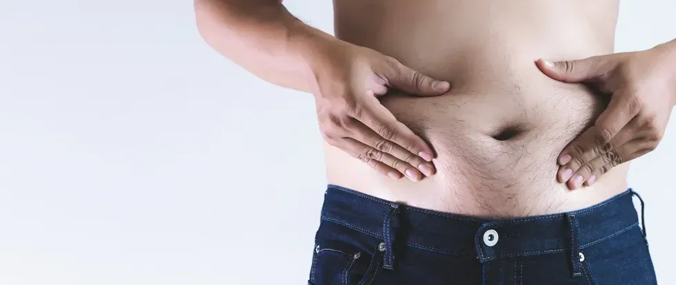 man picking his belly