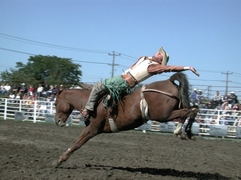 man riding a horse bareback