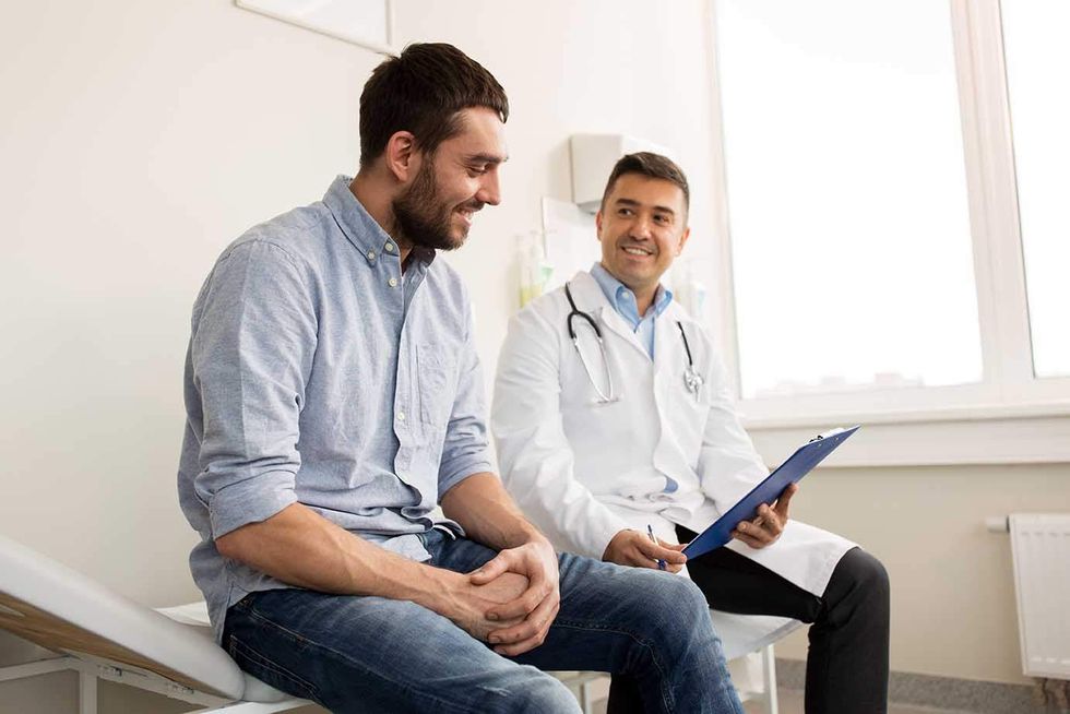 Man sitting with a doctor