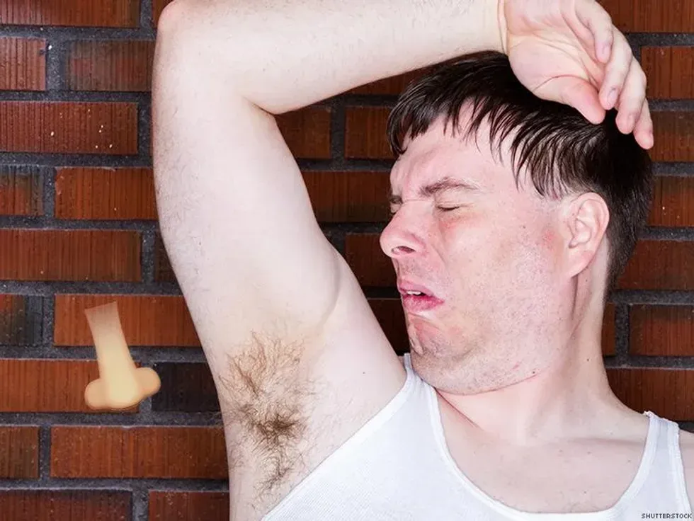 man smelling his armpits