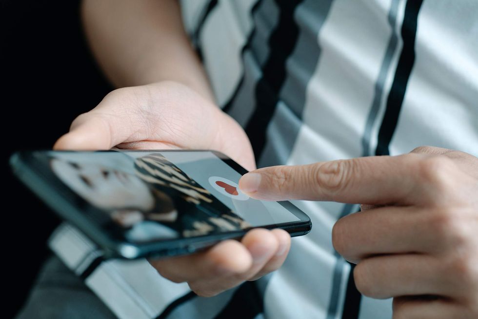 Man swiping on a dating app