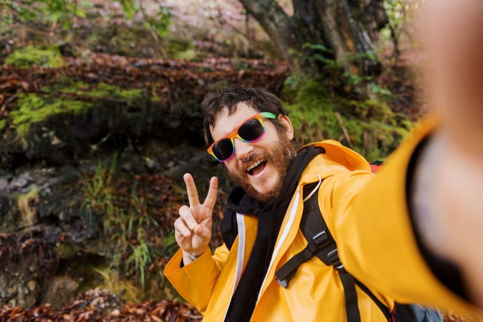 man taking a selfie in nature