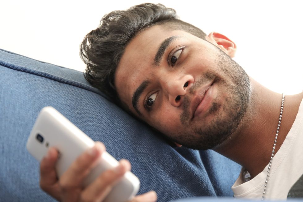 man texting on his phone