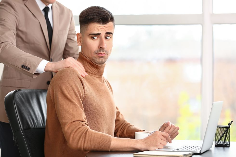 man uncomfortable with other man