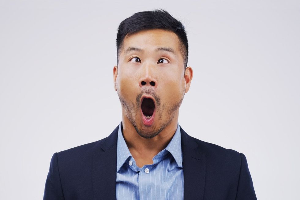 man with eyes crossed and shouting