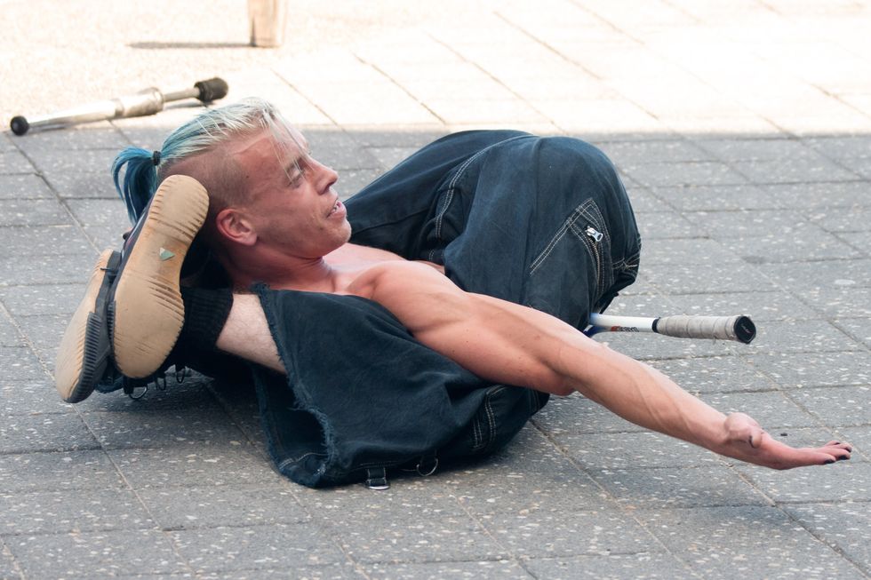 man with legs behind his head