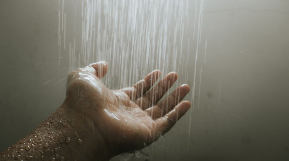 mans hand in the shower