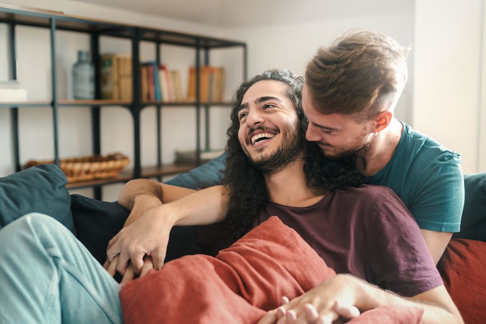 men cuddling and laughing