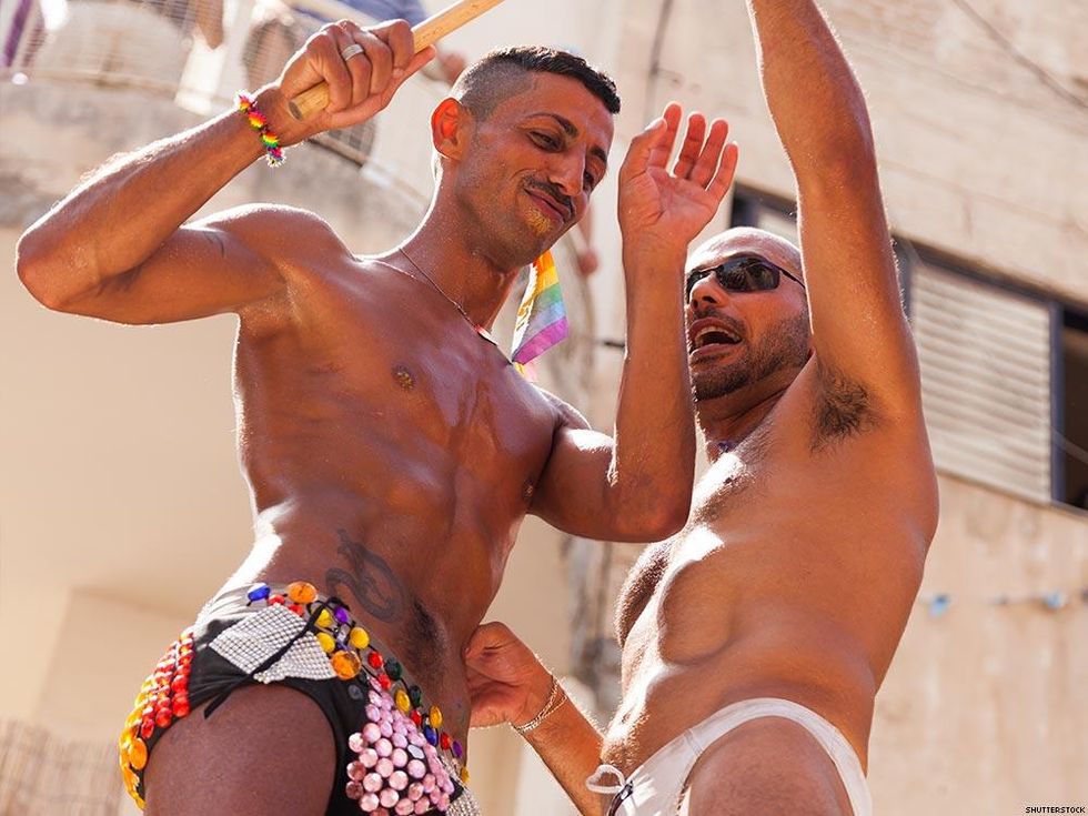 men dancing shirtless