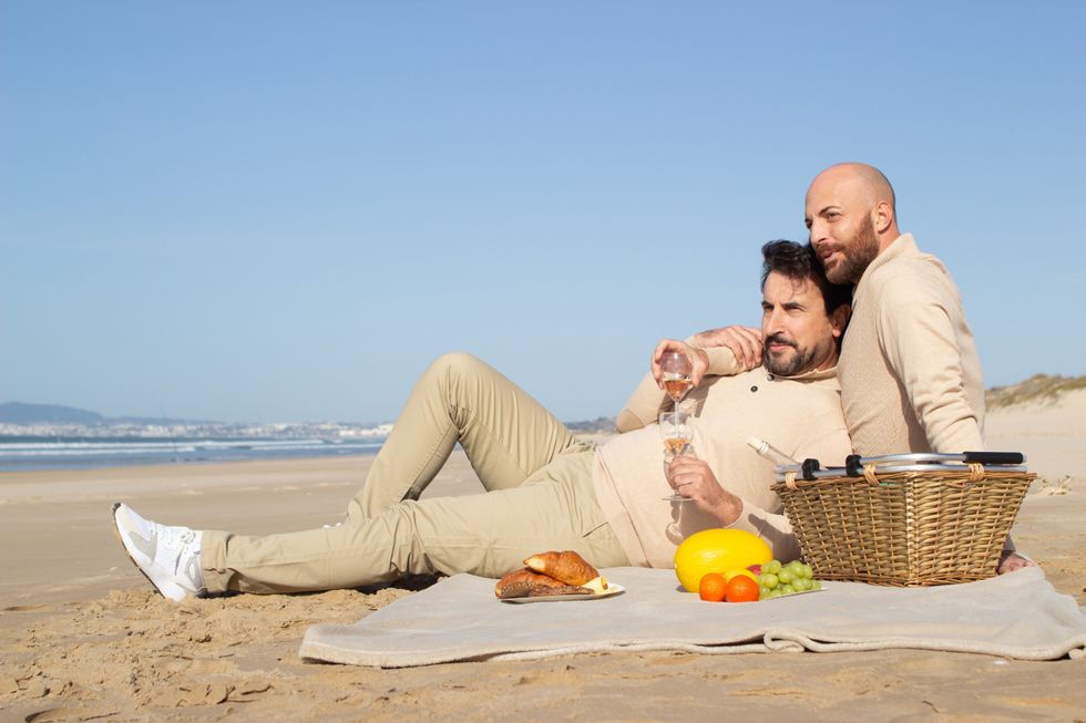 men on a picnic at the beach