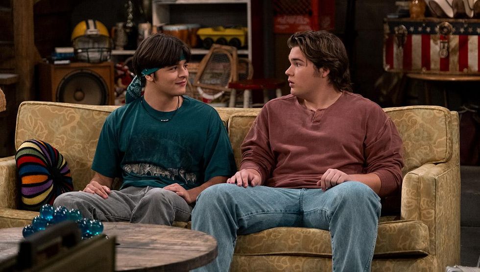 nate and jay sit on a couch together