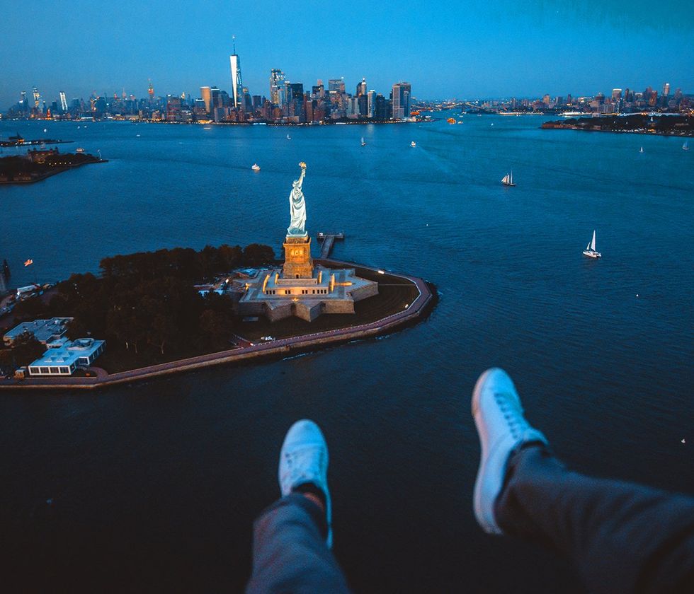 New york City Manhattan from the sky helicopter tour NYC skyline bridges central park world trade tower statue of liberty empire state building all in view