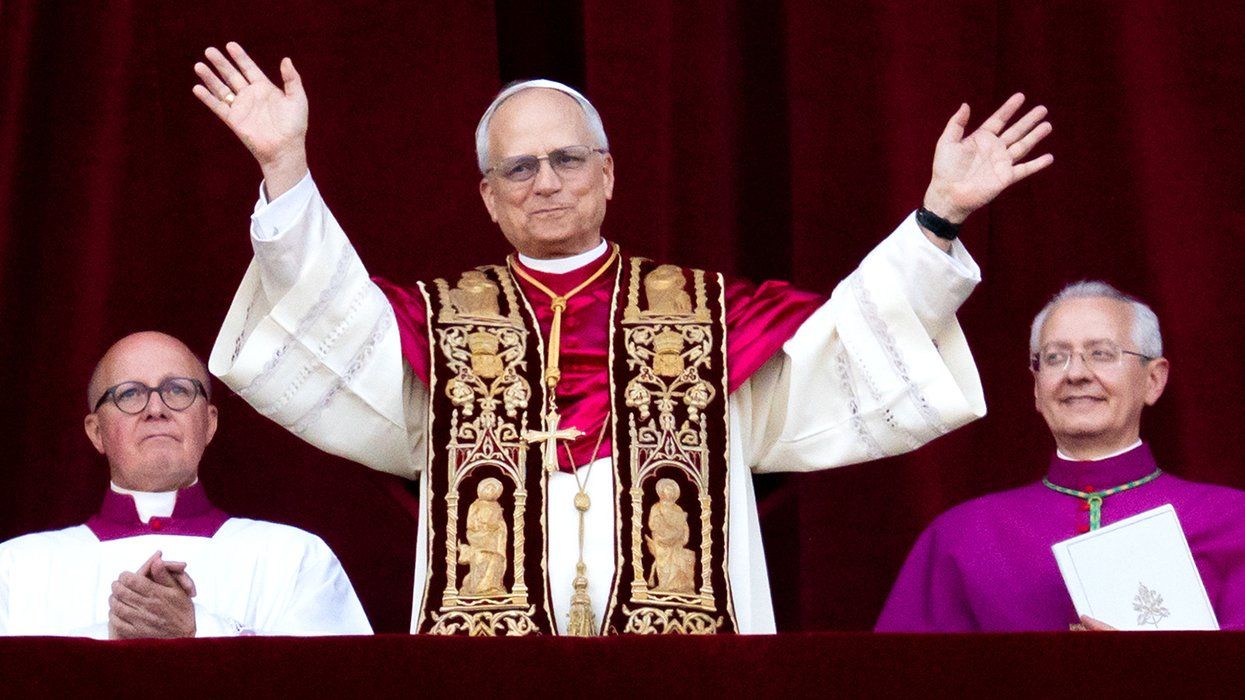 Newly elected Pope Leo XIV cardinal Robert Prevost arrives on the main central loggia balcony of St Peters Basilica for the first time