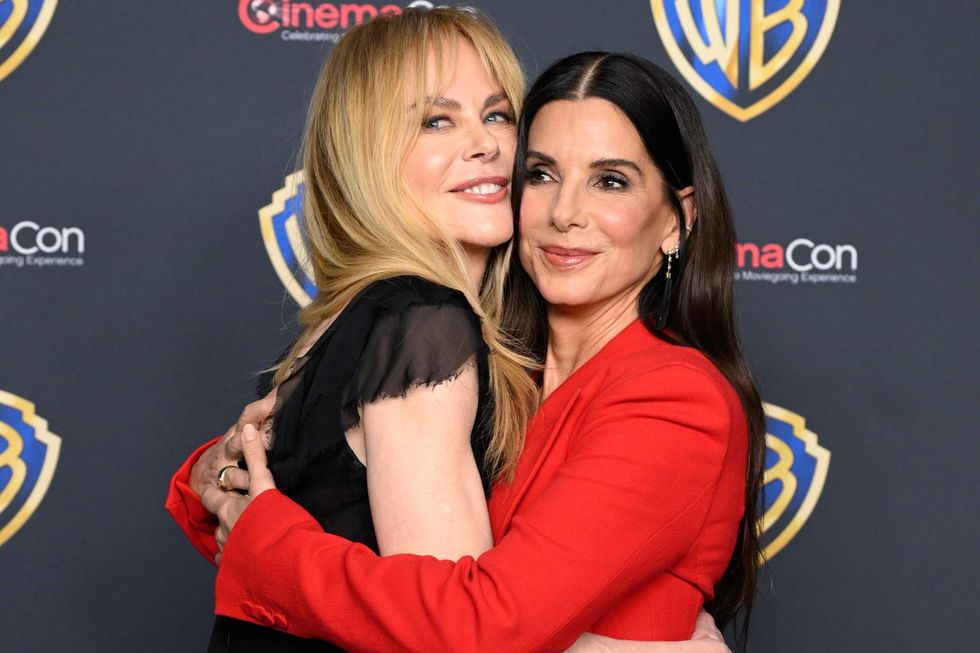 Nicole Kidman and Sandra Bullock embracing