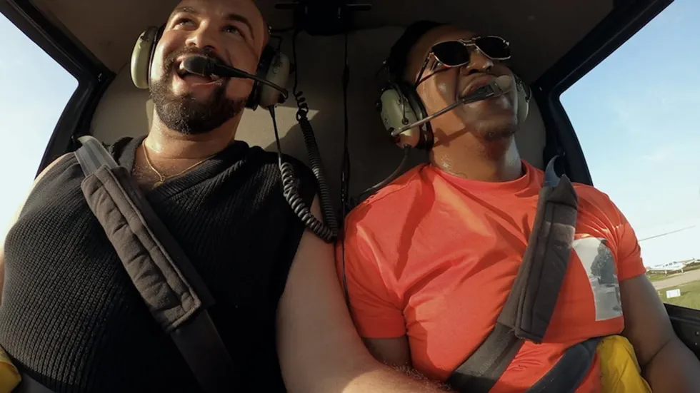 Nigel Rico in a helicopter