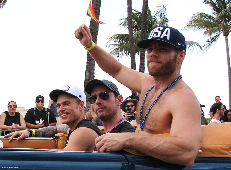 Olympic Gold Medalist and Pride Grand Marshal Gus Kenworthy (left) leads the parade with boyfriend Matthew Wilkas (right) and friend!
