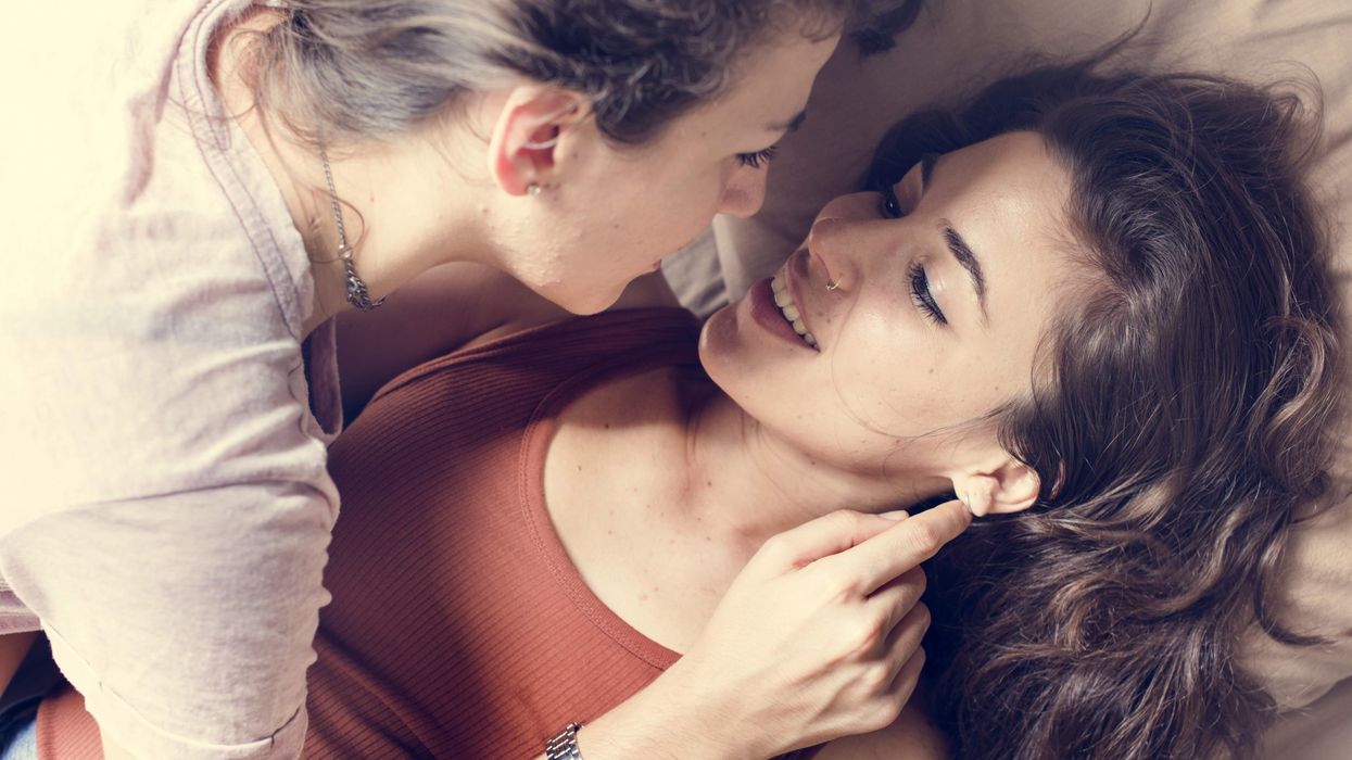 One woman lying on top of a second woman