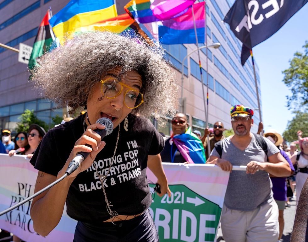 Philadelphia black trans shirt leading parade photo gallery list LGBTQ pride celebrations festivals parades USA 2024