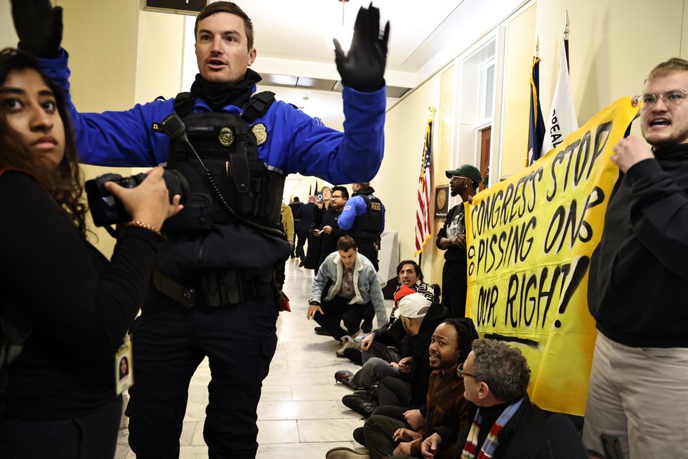 Police officers during Capitol bathroom sit-in