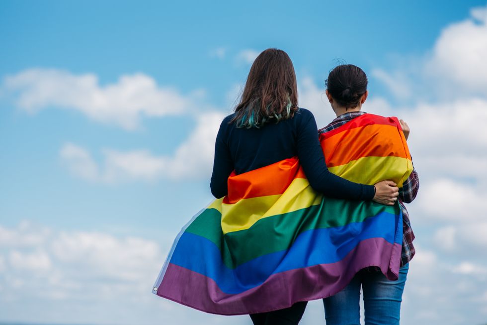 pride flag with two people looking away