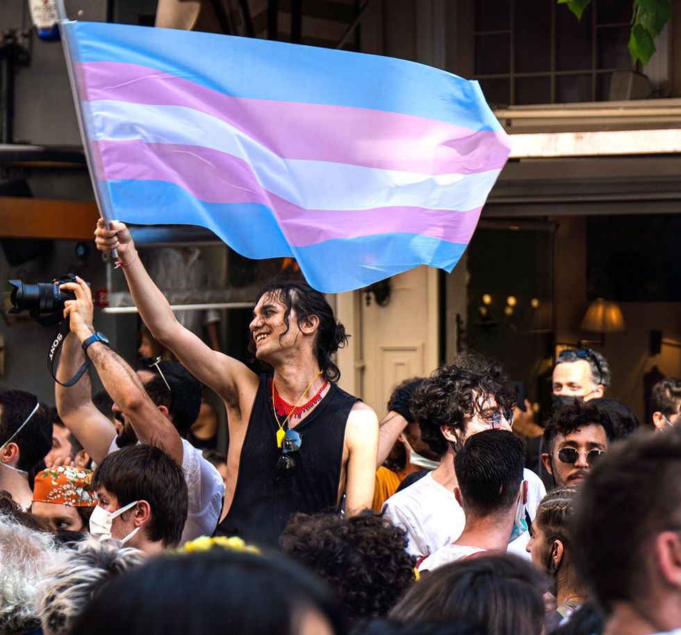 protestor waves the transgender flag during Istanbul Pride