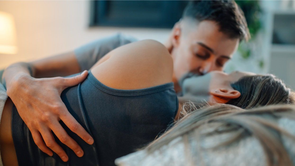 queer women being intimate in bed