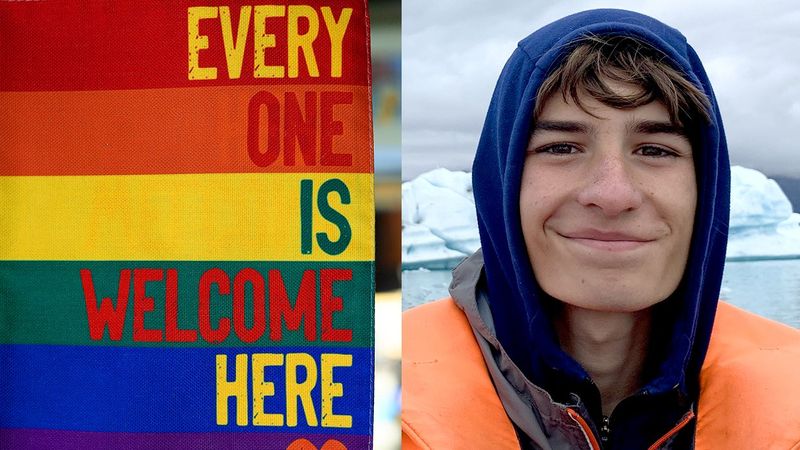 rainbow flag says everyone is welcome here alongside writer Jack Normandin