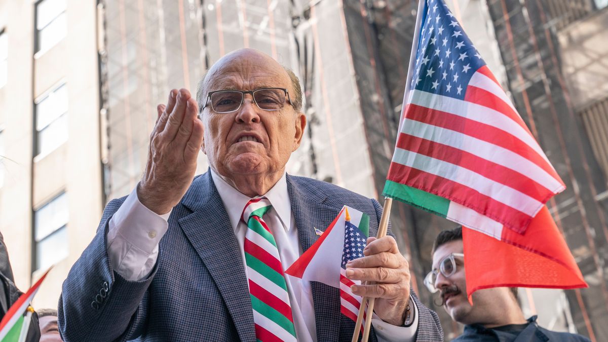 Rudy Giuliani holding an American flag