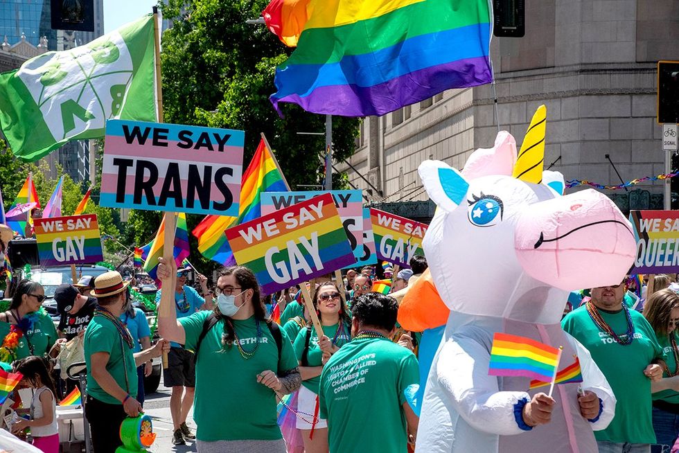 Seattle parade say gay flag trans signs unicorn photo gallery list LGBTQ pride celebrations festivals parades USA 2024
